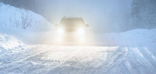 Car driving on snowy road